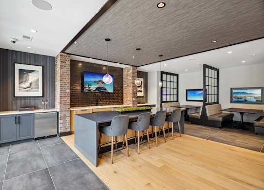 A modern living room with a brick wall and a television.