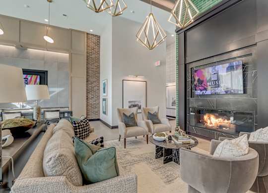 a living room with a fireplace and couches