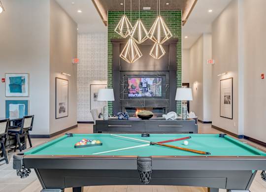 play a game of pool in our clubhouse at our apartments