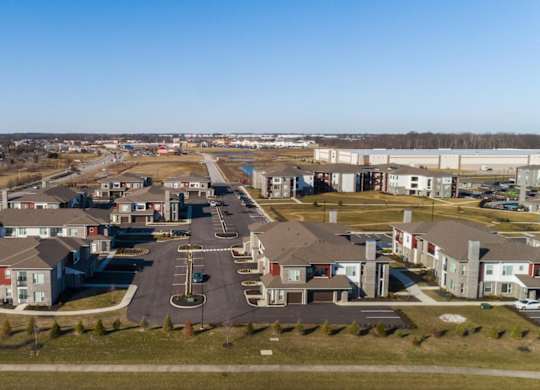 an aerial view of a neighborhood with houses and a road at Echo Park at Perry Crossing Apartments, Plainfield, 46168