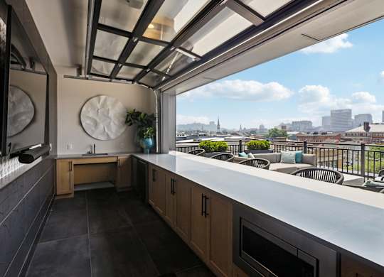 A kitchen with a view of the city.