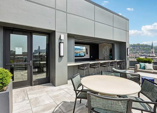 A patio with a table and chairs is shown.