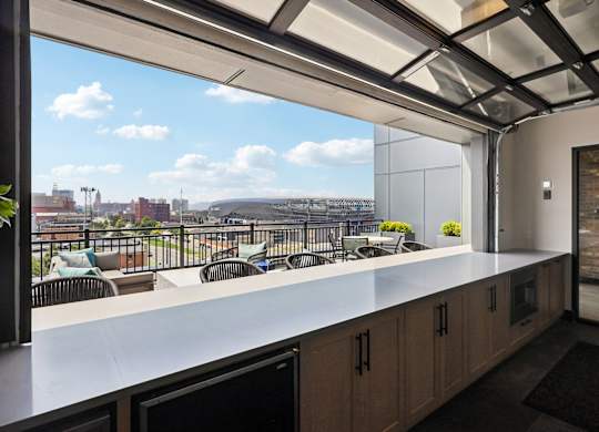 A modern kitchen with a view of the city.