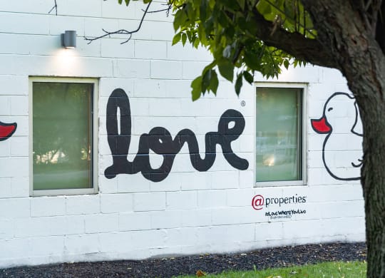 a mural on the side of a white building