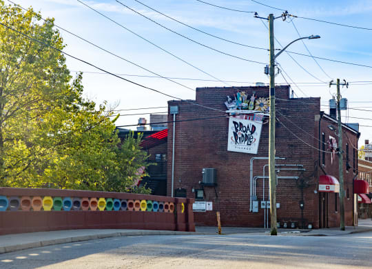 a red brick building with a sign on the side of it