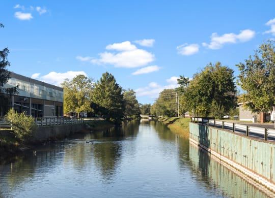 a river running through a city with buildings on either side
