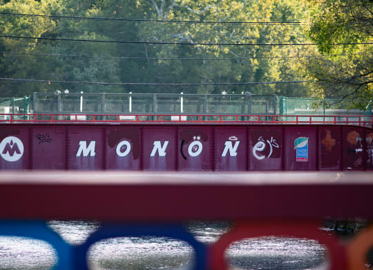 a train bridge with the word momomo written on it