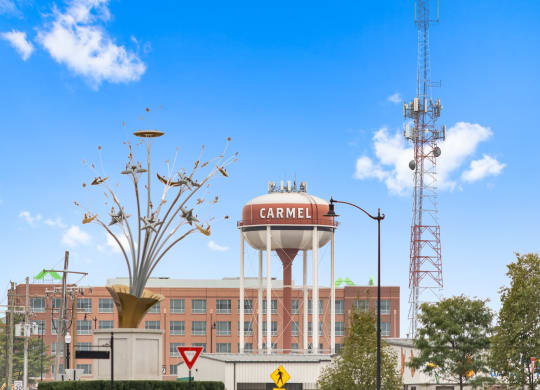 a water tower on top of a building in front of a hospital