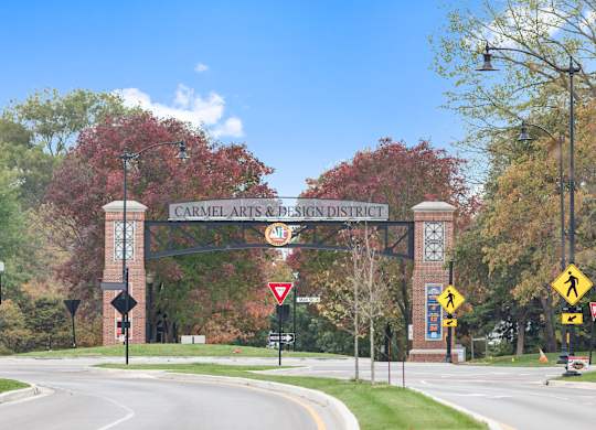 a sign for the central arts and science district on the side of a road at Providence at Old Meridian Apartments , Carmel, 46032