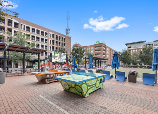 a park with a ping pong table