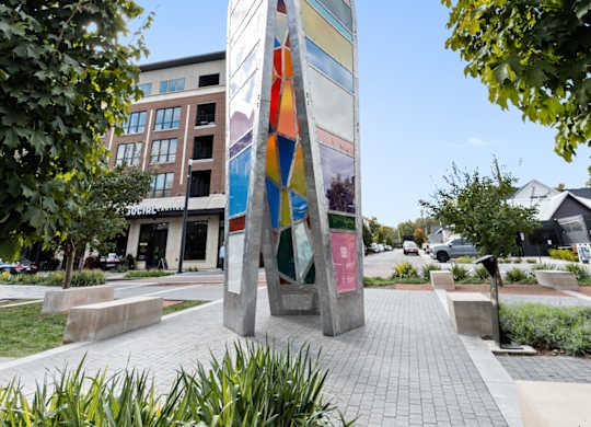 a tall monument in the middle of a park with trees at Providence at Old Meridian Apartments , Carmel, 46032
