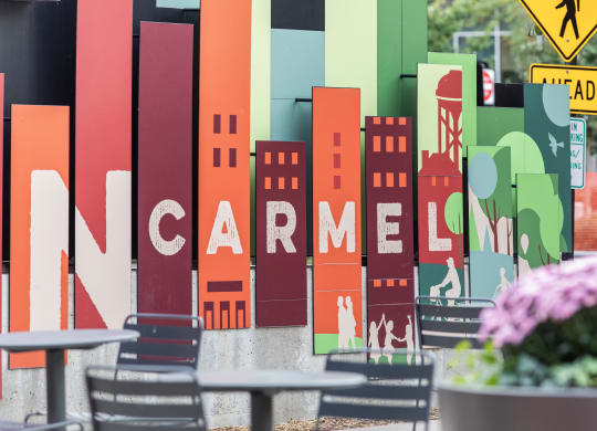 a sign for a restaurant with a city skyline on it