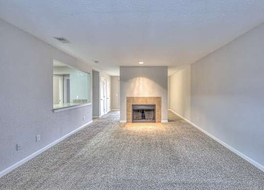 A long, empty hallway with a fireplace at the end at Landmark at Lyncrest Reserve Apartments, Nashville, TN, 37209