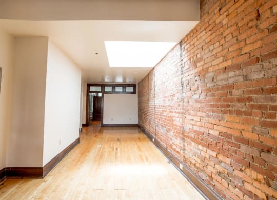 Living Area space with Exposed Brick at Lockerbie Court on Mass Ave, Indianapolis
