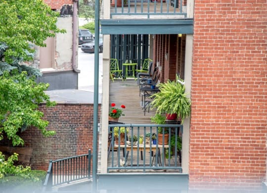 Outdoor Space with sitting area and exposed brick design at Lockerbie Court on Mass Ave, Indianapolis, 46204