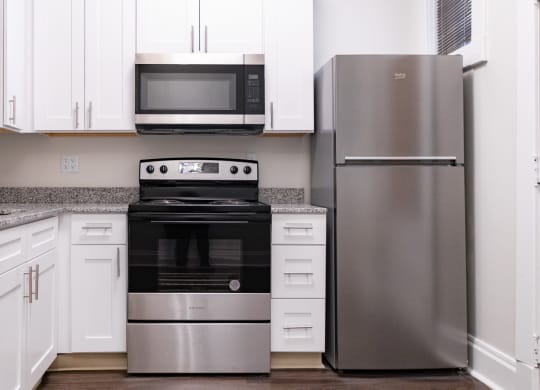 Spacious Kitchen With Pantry Cabinet at Lockerbie Court on Mass Ave, Indianapolis, IN, 46204