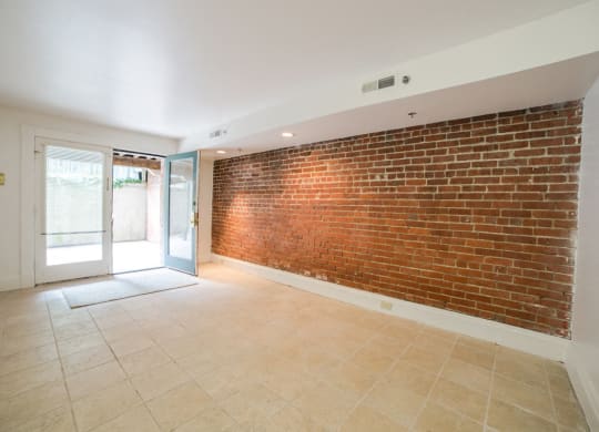 Living Area with Exposed Brick at Lockerbie Court on Mass Ave, Indianapolis