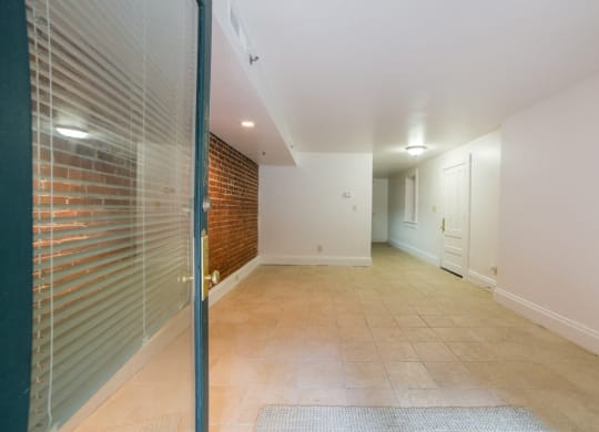 Living Area with Exposed Brick wide angle at Lockerbie Court on Mass Ave, Indiana