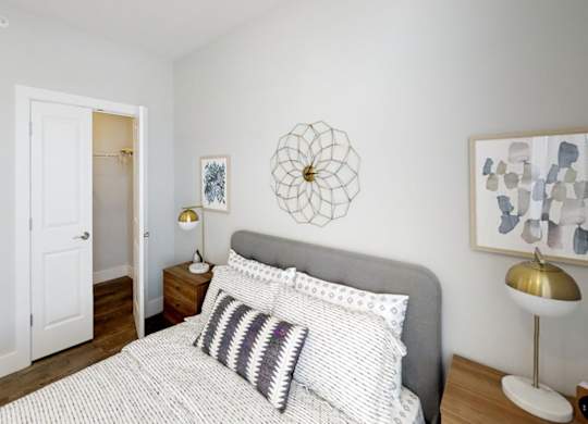bedroom with white bedding at Echo Park at Perry Crossing Apartments, Plainfield, 46168