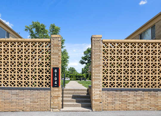 Mid-century modern entry wall and address marker at 6104 E 61st Street, entrance to Monon Court apartments in Broad Ripple
