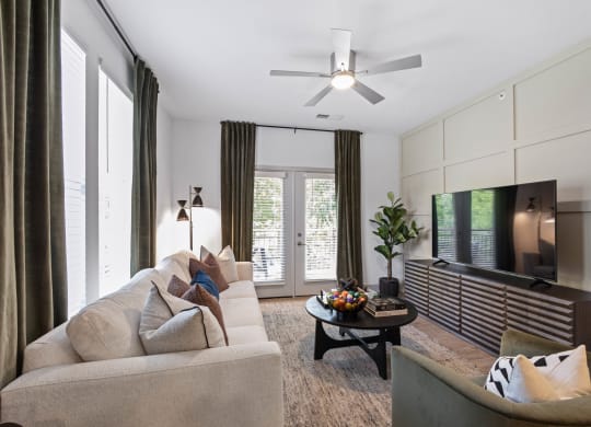 a living room with a couch and a tv