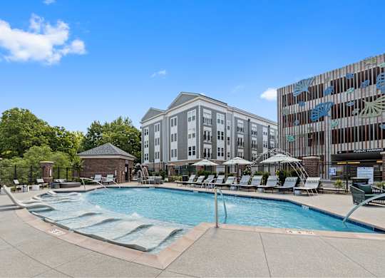 a swimming pool with a building in the background
