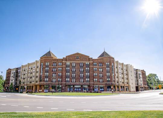 a large building with a street in front of it