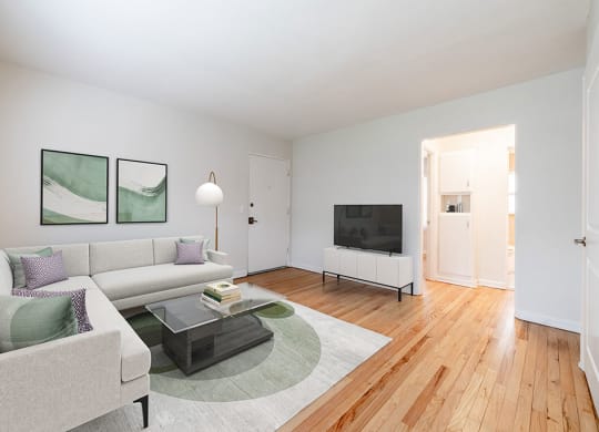 a living room filled with furniture and a flat screen tv