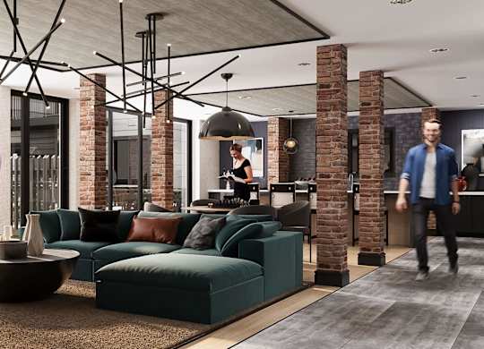 Stylish resident lounge at Contrast OTR in Cincinnati, Ohio, featuring exposed brick accents, modern lighting fixtures, plush seating, and floor-to-ceiling windows for an upscale urban living experience