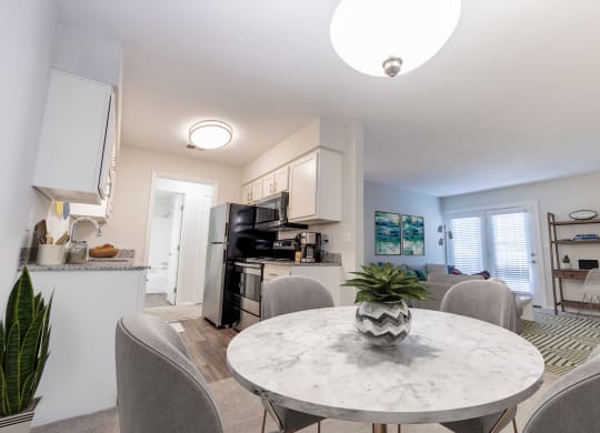 Dining Area With Kitchen View at Gramercy, Carmel, Indiana