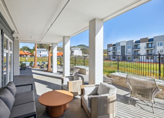 a living room with couches and a coffee table on a balcony at 38° NORTH, Santa Rosa, CA 95404