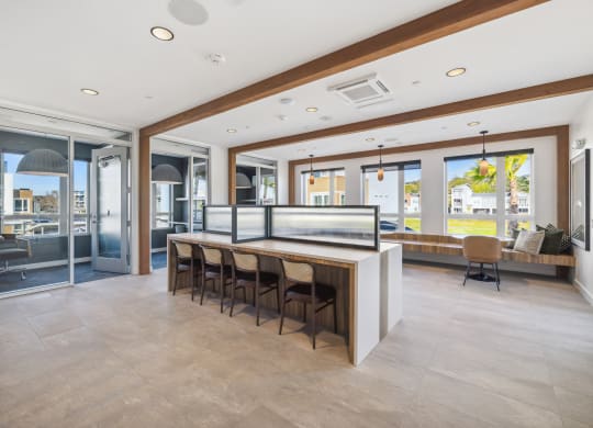 a large kitchen with a bar and chairs in front of it at 38° NORTH, Santa Rosa California