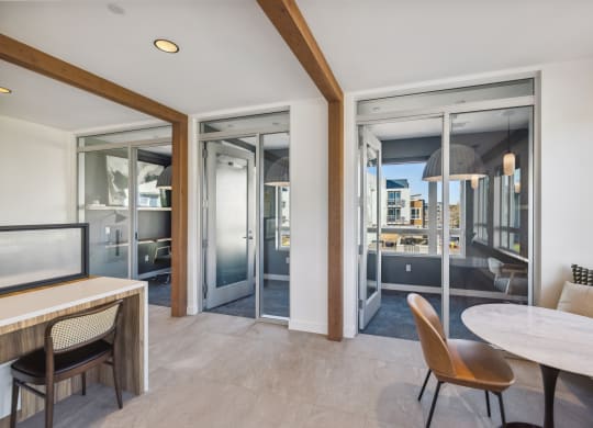 a living room and dining room with sliding glass doors and a view of the city at 38° NORTH, Santa Rosa California 