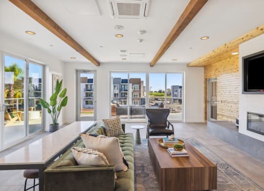 a living room with a couch and a coffee table and a television at 38° NORTH, Santa Rosa, CA 