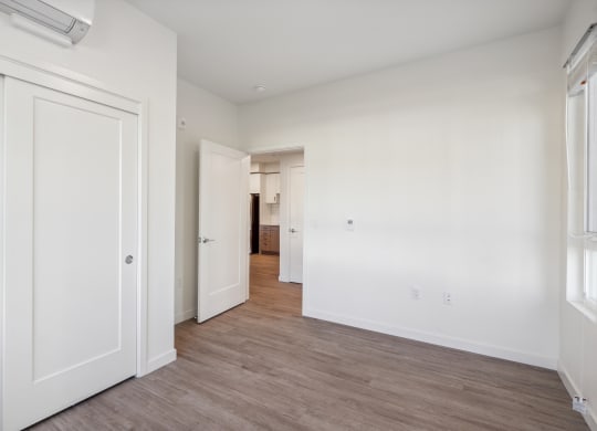 an empty bedroom with white walls and wood flooring at 38° NORTH, California 