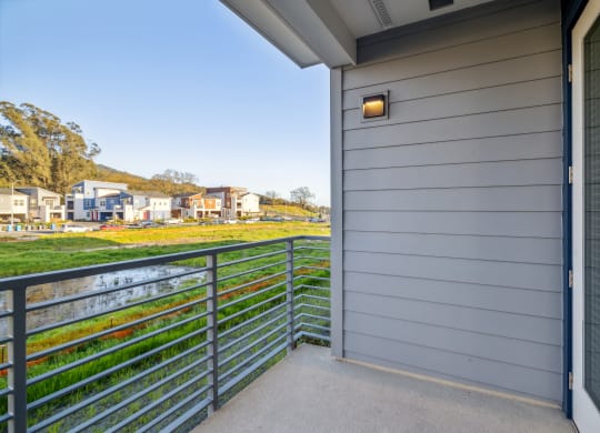the view from the balcony of a house looking out onto a yard and a river at 38° NORTH, Santa Rosa California