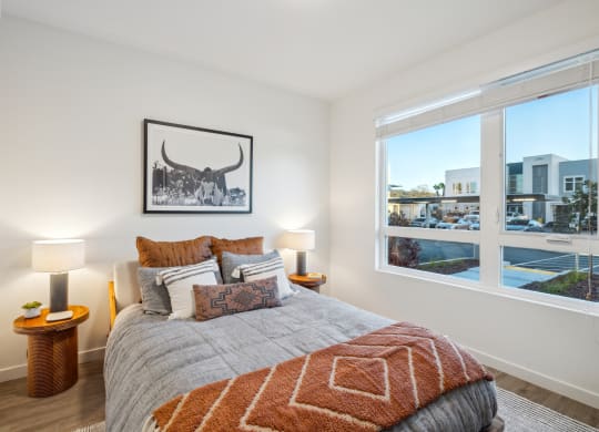 a bedroom with a bed and a window with a city view at 38° NORTH, Santa Rosa, CA