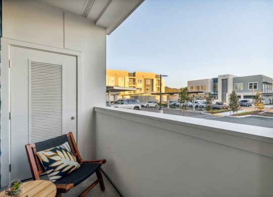 a balcony with a chair and a window overlooking a street at 38° NORTH, Santa Rosa California