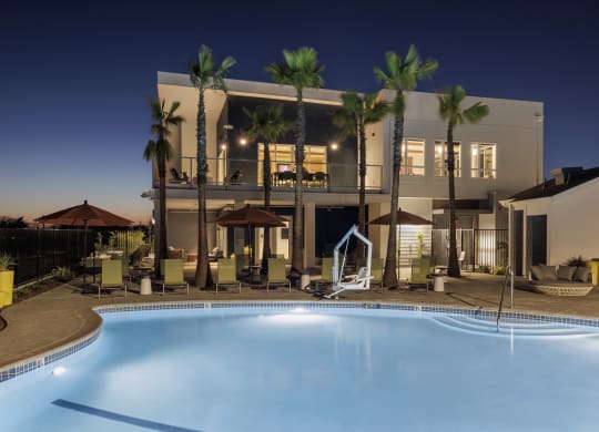 a large swimming pool in front of a hotel at night at 38° NORTH, Santa Rosa, 95404