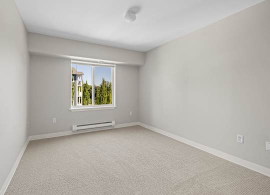 A room with a window and a door.