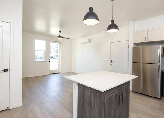 A kitchen with a white counter top and a stainless steel refrigerator. at 38° NORTH, Santa Rosa, California