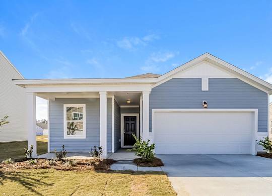 a blue house with a white garage door