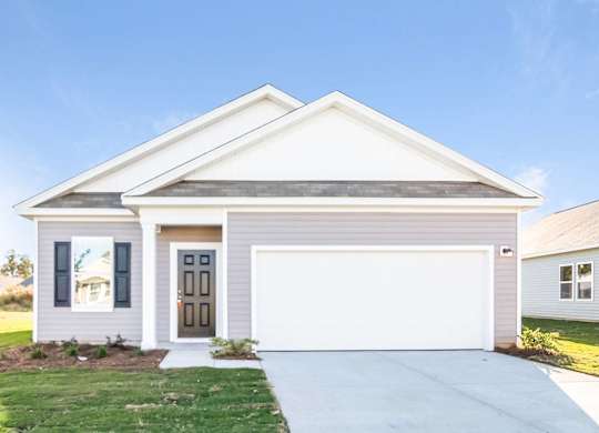 a white house with a white garage door