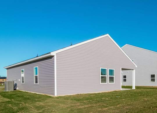 a house with a blue sky in the background