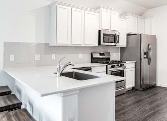 Homes in Humble TX for Rent - Edgewater at the Lagoon - Modern Kitchen with Stainless Steel Appliances