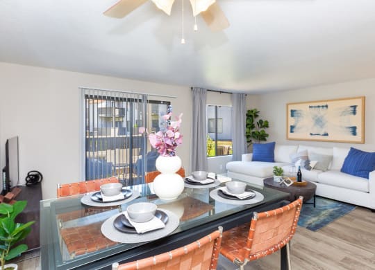 an open living room and dining room with a table and chairs