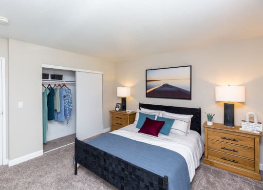 1-BR Apartments In Moreno Valley, CA - Sorelle Apartments - Spacious Bedroom With Plush Carpet Flooring And Closet With Sliding Door.