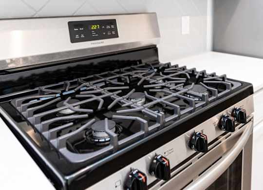 a black and silver stove top oven in a kitchen
