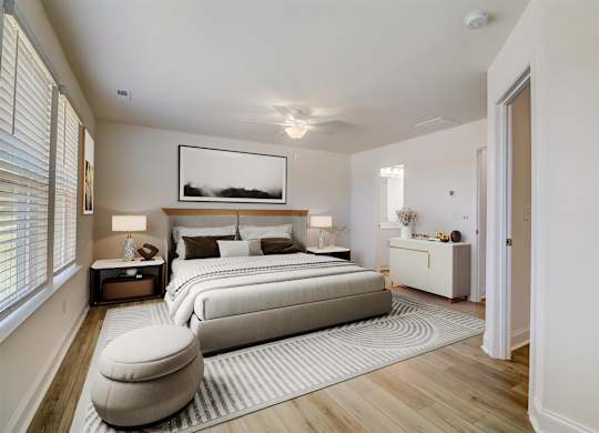 A bedroom with a large bed and a painting above it.
