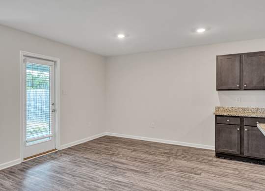 A room with a door and a counter.